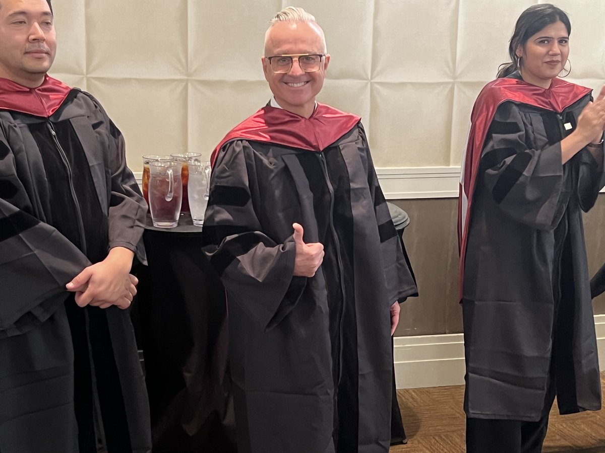 Dr. Joe Mehranfar in academic robes at his board certification ceremony