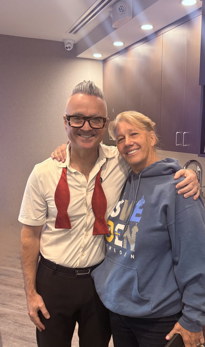 Dr. Joe Mehranfar with a happy Aria patient celebrating her new smile